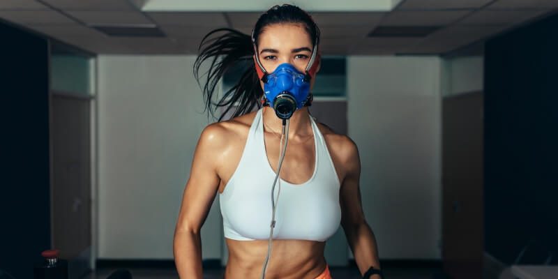 Woman On Treadmill With Oxygen Mask On